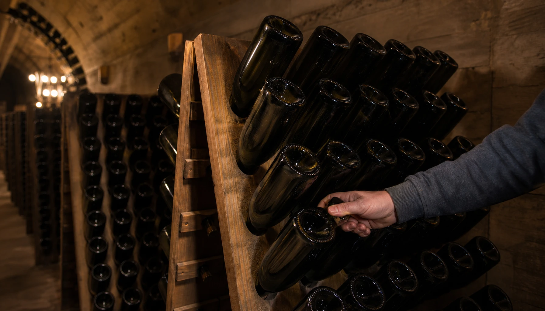Neck-down in the A-frame riddling racks — a small turn each day until the wine runs clear